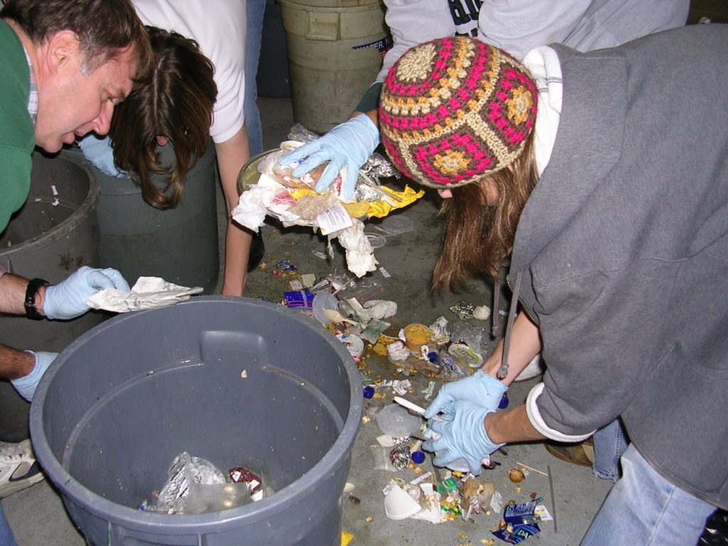 Students analyze how much of Spartan Stadium trash is recyclable.