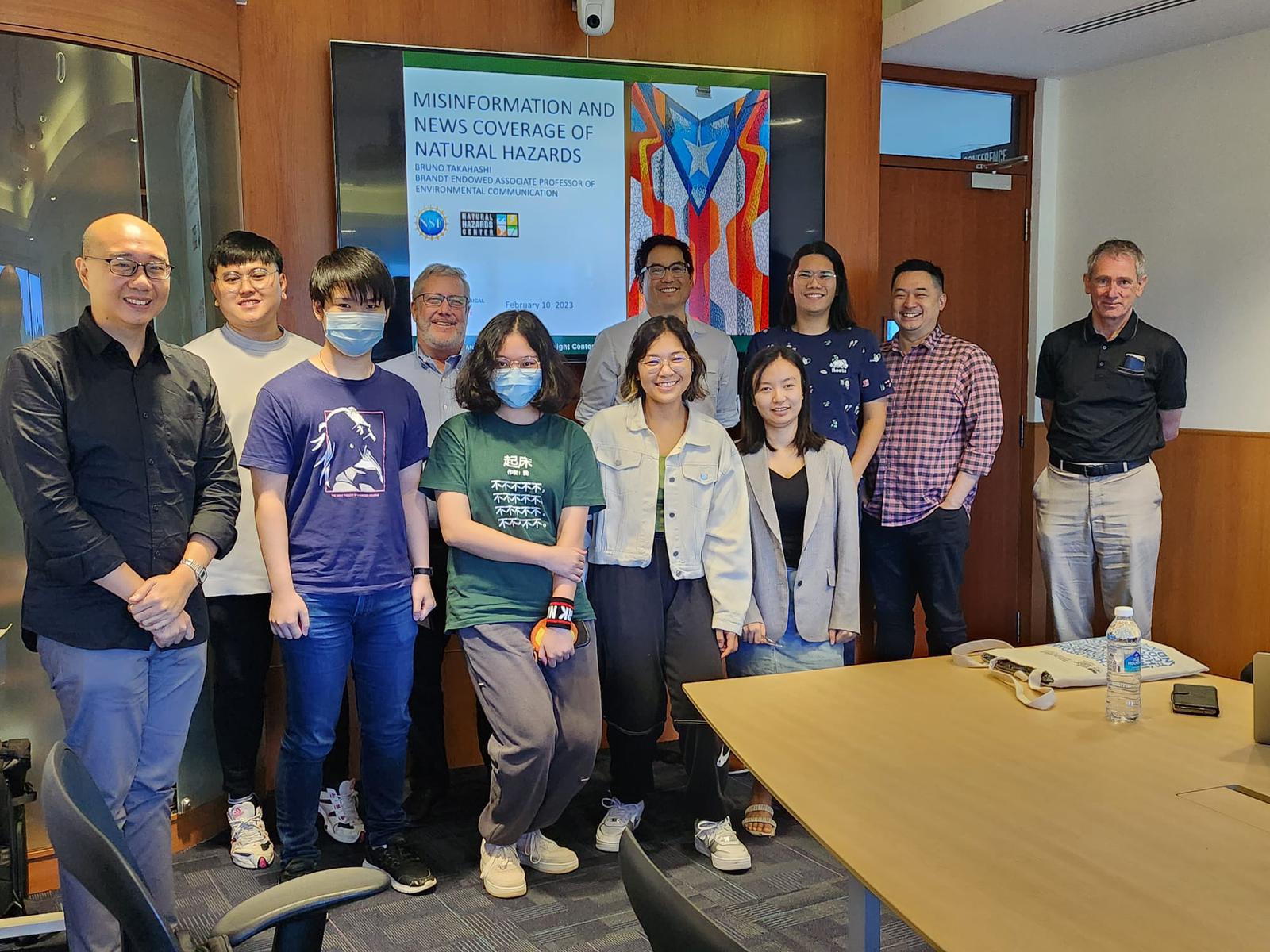 Dr. Takahashi poses with students at Nanyang Technological University following his presentation on misinformation and news coverage of natural hazards. 